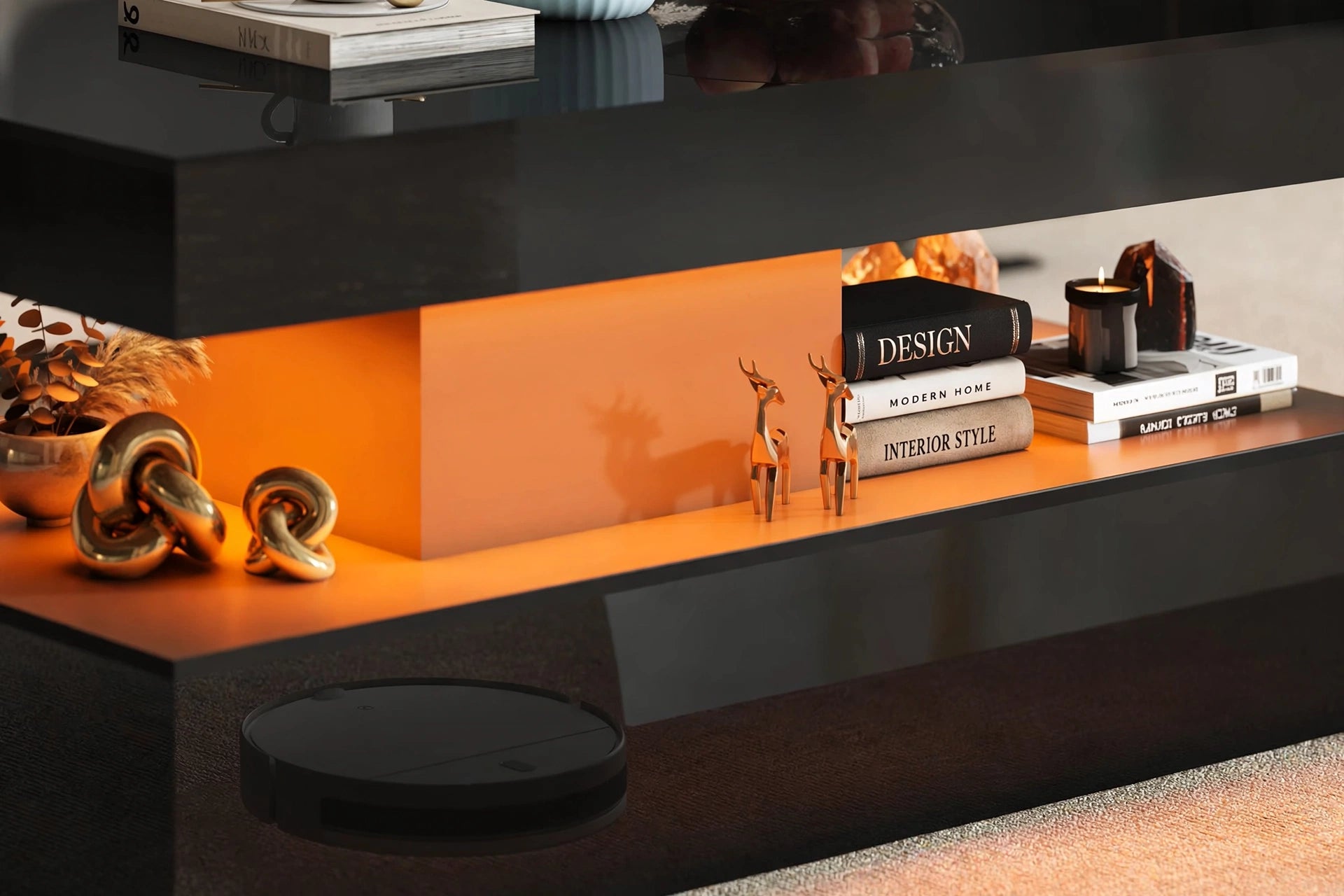 Close-up of coffee table middle tier with warm LED lighting, design books and gold deer figurines on display