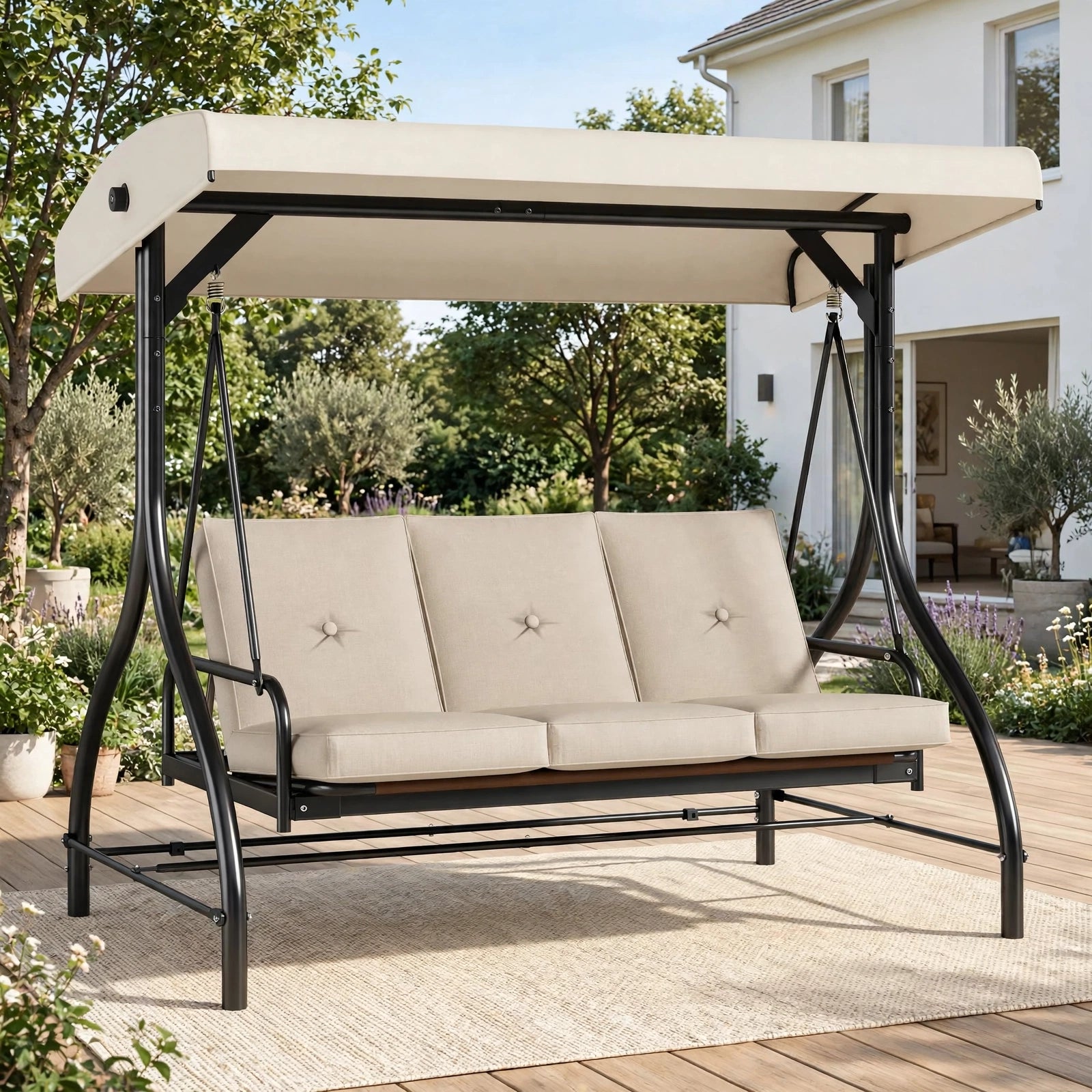 Premium 3-seater patio swing in cream with adjustable canopy in lush garden setting with house in background